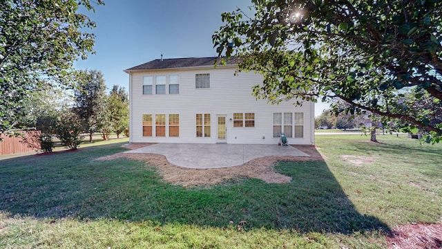 back of property featuring a patio area and a lawn