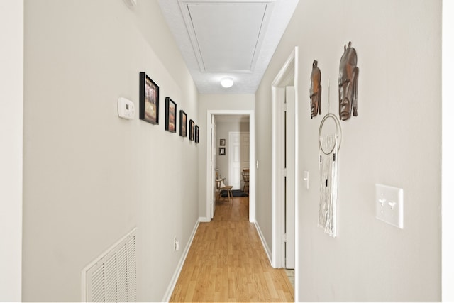 corridor with light wood-type flooring