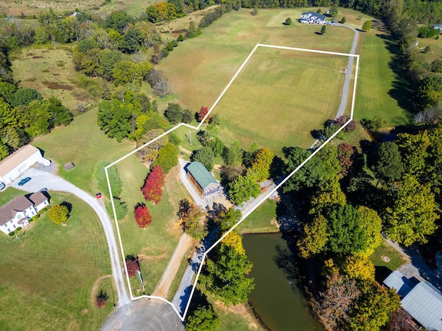 aerial view with a rural view and a water view