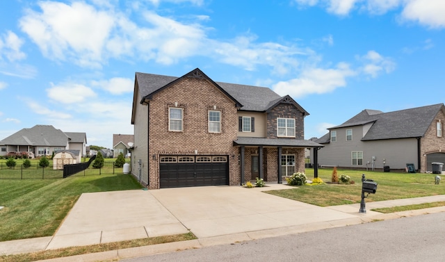 view of front facade with a front yard and a garage