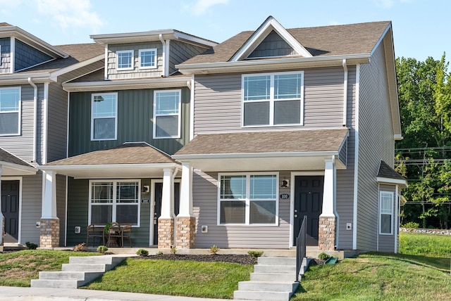 craftsman-style home featuring a front yard