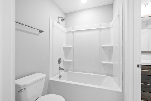 full bathroom featuring toilet, vanity, and washtub / shower combination