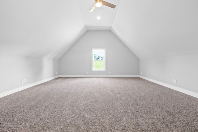 bonus room with vaulted ceiling, carpet floors, and ceiling fan