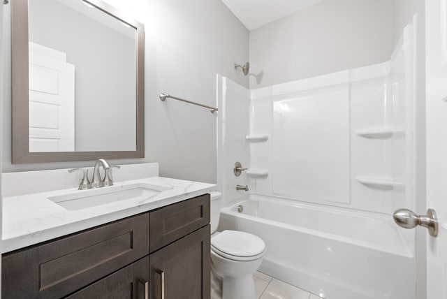 full bathroom featuring vanity, washtub / shower combination, tile patterned flooring, and toilet