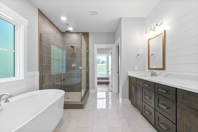 bathroom with vanity and plus walk in shower