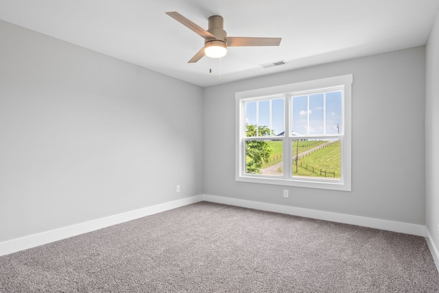 carpeted empty room with ceiling fan