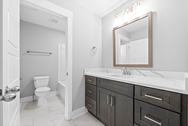 bathroom featuring vanity and toilet