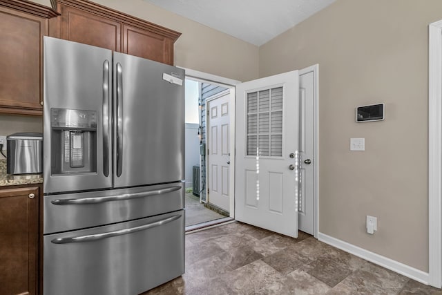 kitchen with stainless steel fridge with ice dispenser