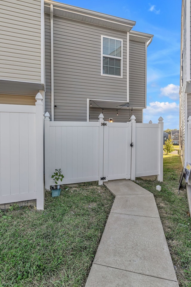 view of property exterior with a yard