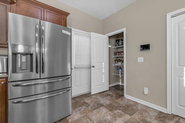 kitchen featuring stainless steel fridge