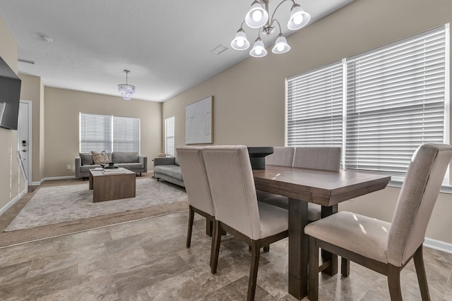 dining area featuring a chandelier