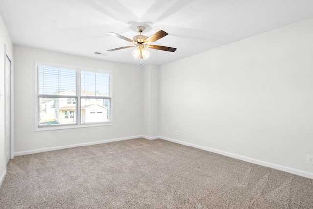 carpeted empty room with ceiling fan