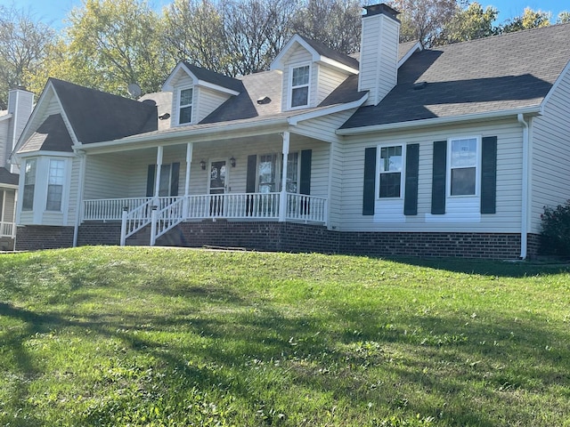 cape cod house with a porch and a front lawn