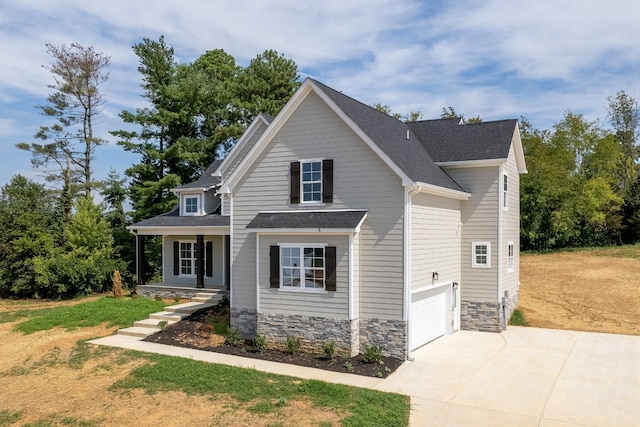 view of front of house with a front lawn and a garage