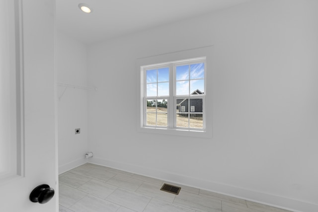 washroom featuring hookup for an electric dryer