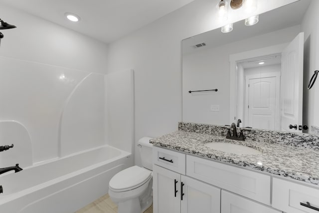 full bathroom with bathtub / shower combination, vanity, and toilet