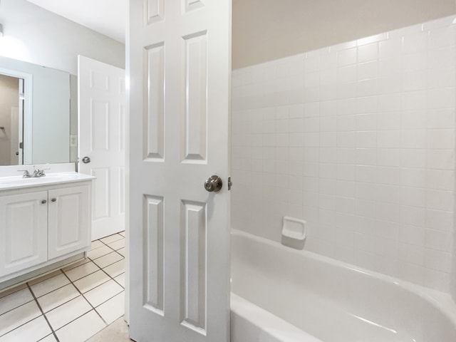 bathroom featuring vanity, tile patterned floors, and  shower combination