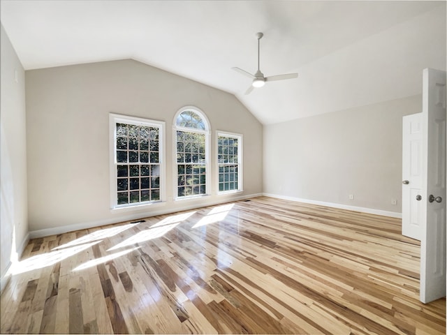 interior space with lofted ceiling, light wood-type flooring, and ceiling fan