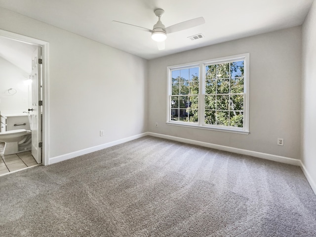 empty room with light carpet and ceiling fan