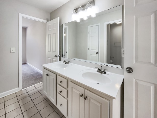 bathroom featuring vanity, toilet, and tile patterned floors