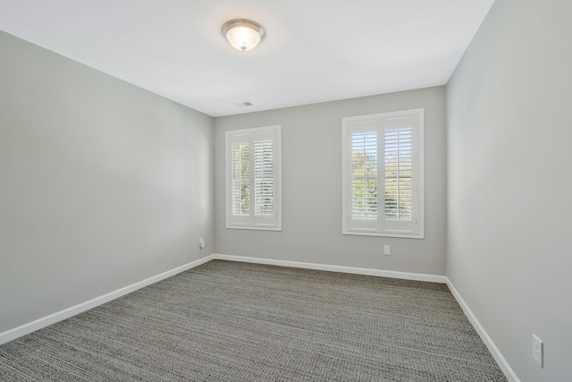 empty room with carpet flooring