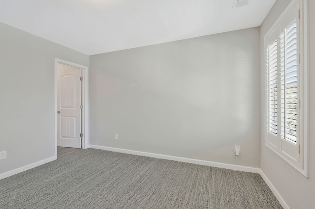 unfurnished room featuring carpet flooring