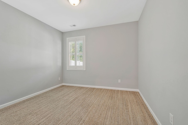 spare room featuring carpet flooring