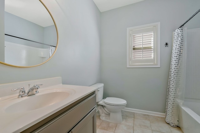 full bathroom featuring vanity, shower / bath combo with shower curtain, toilet, and tile patterned floors