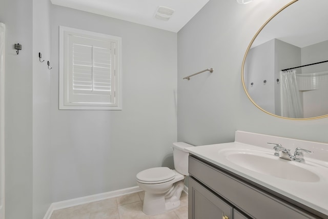 bathroom featuring toilet, vanity, a shower with shower curtain, and tile patterned flooring