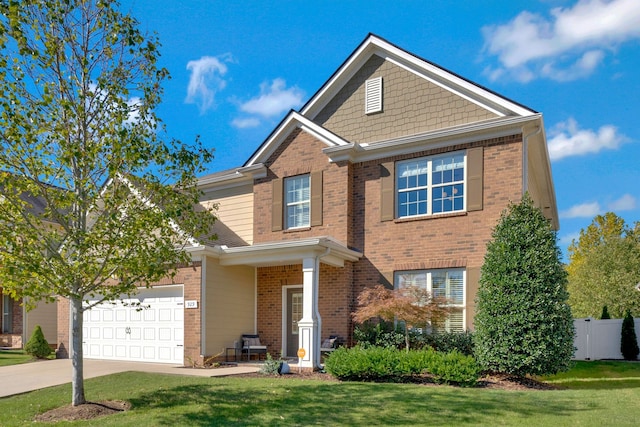 view of front of home featuring a front lawn and a garage