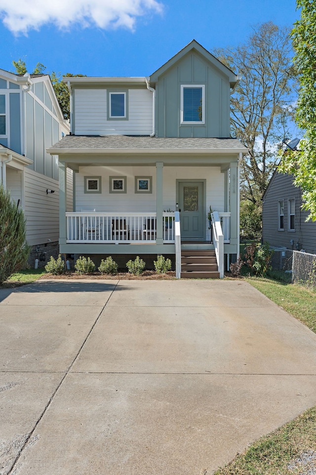 view of front of house with central AC and covered porch