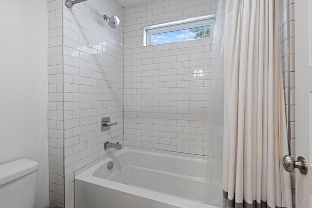 bathroom with toilet and shower / bathtub combination with curtain