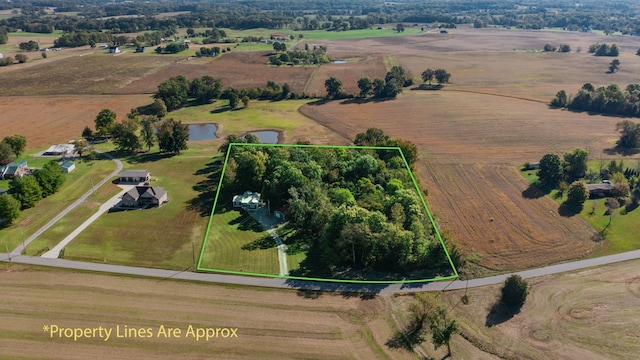 drone / aerial view with a water view and a rural view