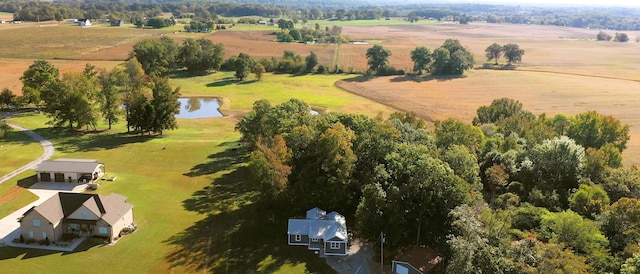 birds eye view of property featuring a water view and a rural view