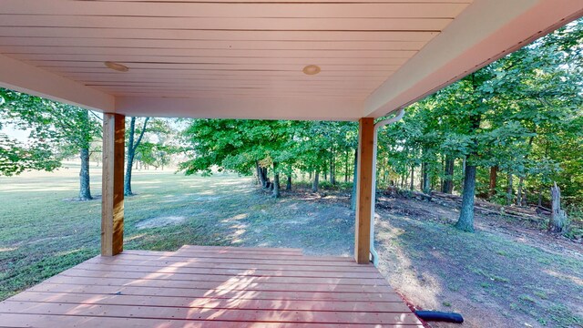 wooden terrace with a yard