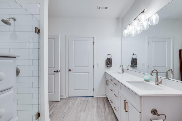 1677 54th Ave N Unit 218, Nashville, TN 37209 - bathroom with tiled shower and double vanity