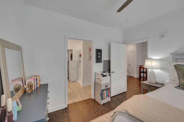 1677 54th Ave N Unit 218, Nashville, TN 37209 - bedroom with dark wood-style flooring, baseboards, and a ceiling fan