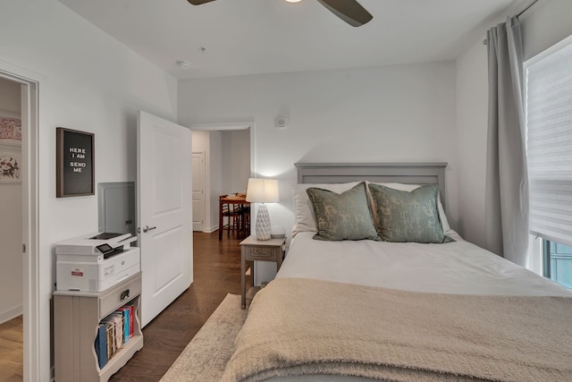 bedroom with ceiling fan and dark hardwood / wood-style floors