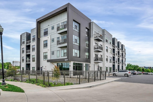 1677 54th Ave N Unit 218, Nashville, TN 37209 - view of apartment building / complex featuring fence