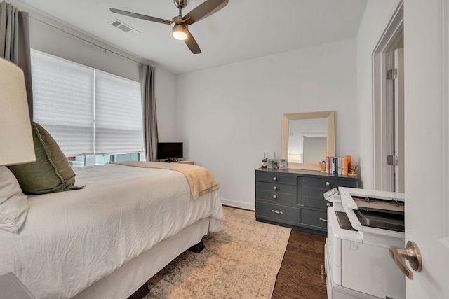 bedroom featuring dark hardwood / wood-style flooring and ceiling fan