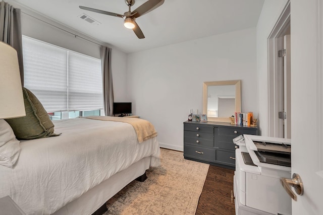 1677 54th Ave N Unit 218, Nashville, TN 37209 - bedroom with dark wood-style flooring and a ceiling fan