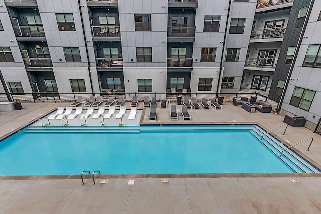 1677 54th Ave N Unit 218, Nashville, TN 37209 - community pool featuring a patio area, an outdoor hangout area, and central AC unit