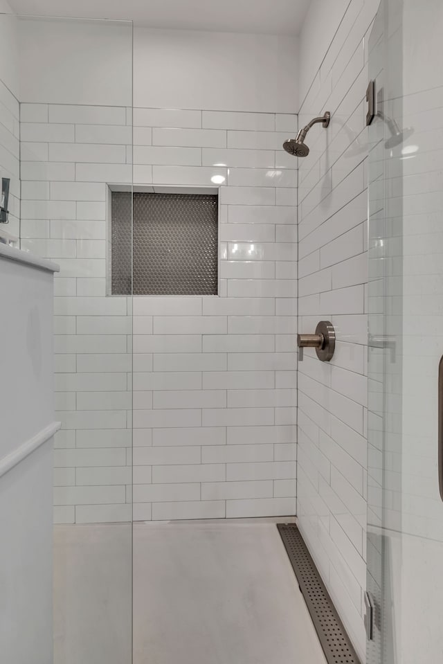 bathroom with a shower with shower door