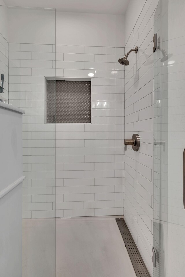 1677 54th Ave N Unit 218, Nashville, TN 37209 - bathroom featuring tiled shower