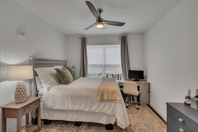 bedroom featuring wood-type flooring and ceiling fan