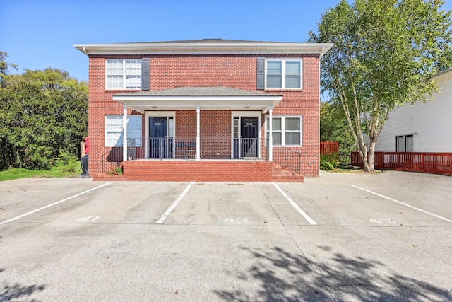 rear view of property with a porch