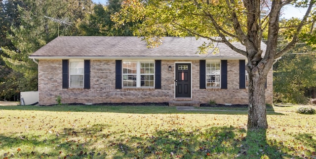 ranch-style house with a front lawn