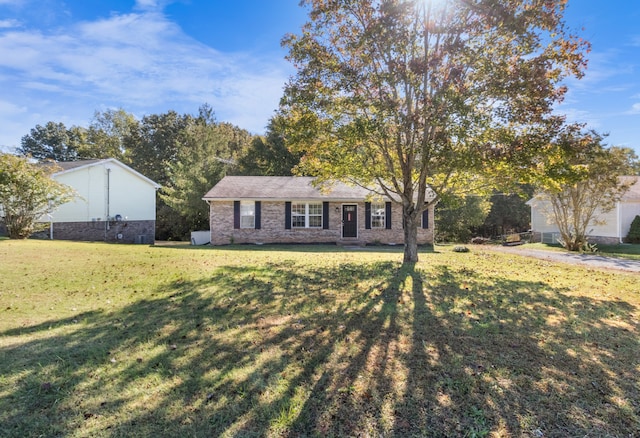 ranch-style home with a front lawn