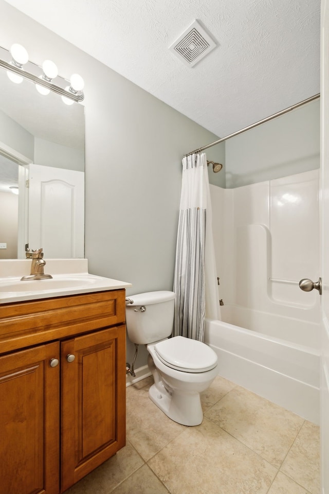 full bath featuring visible vents, toilet, a textured ceiling, vanity, and tile patterned floors