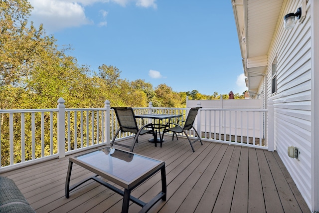 wooden deck with outdoor dining space